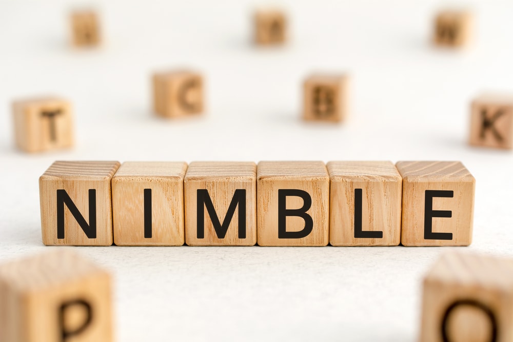 Content marketing during a crisis Building blocks assembled to show the word "nimble."