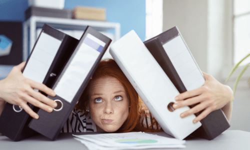 how to start a content strategy - Woman weighed down by 4 3-inch binders on her head