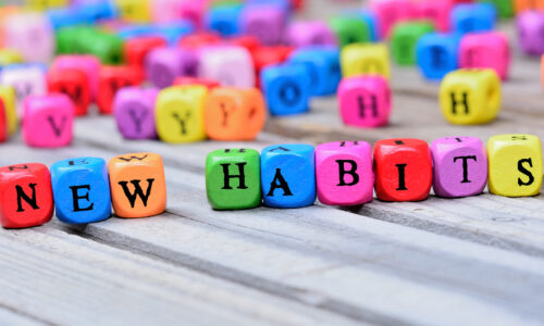 Colored blocks spelling out "new habits"