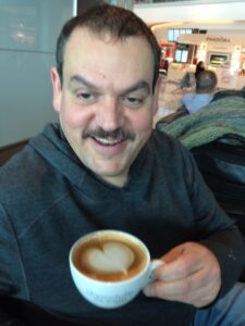 George Stenitzer with a latte - Caffeinate Your Customers