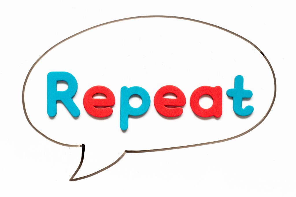 Word balloon with the word "repeat"